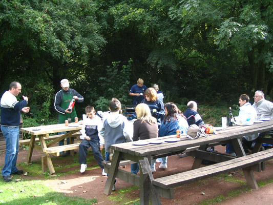 The whole group round the BBQ